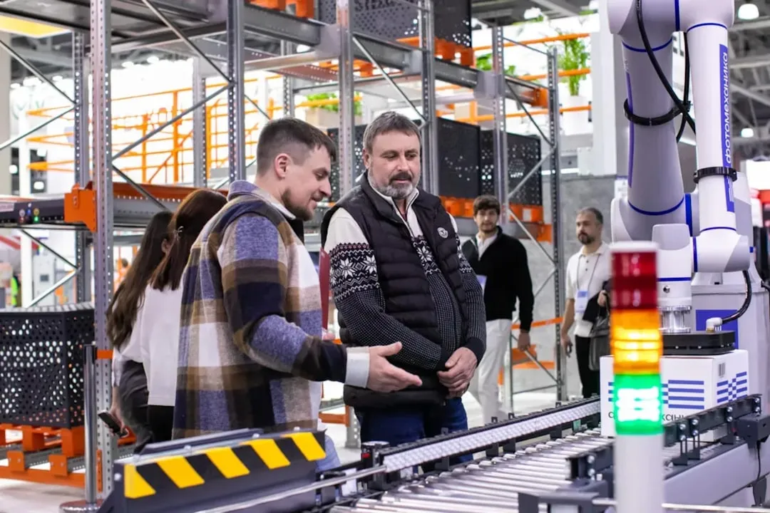 Warehouse manager reviewing finished goods inventory levels