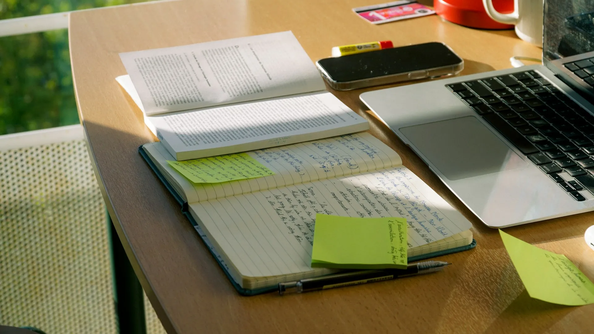 Book and laptop with a plan